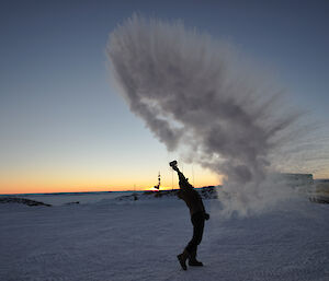 Matt Melhuish making a cloud by throwing a cup of boiling water into the air when it is very cold (minus 30 degrees C) at Casey winter 2014