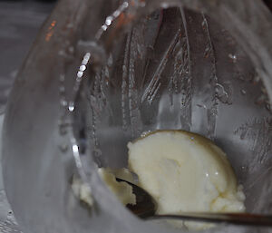 A large, teardrop shaped, thin ice ‘igloo’ containing lemon sherbet sorbet
