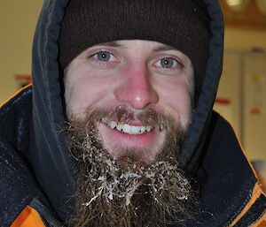 Close up of Cary Collis at Casey 2014 with ice on his beard and a red, cold face