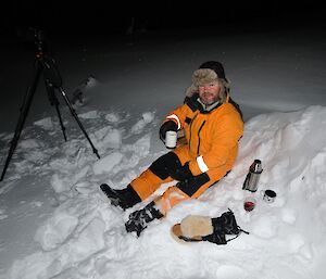 Rob Bennett at the outdoor movie in a freezer suit for the cold with a cup of coffee from a thermos — Casey winter 2014