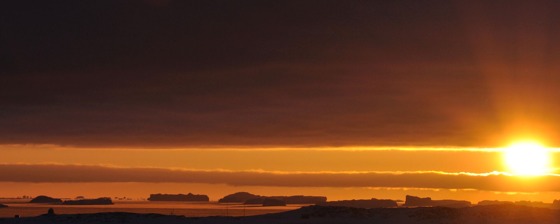 At Casey during June the sun rises then sets again very quickly — the photo is sunrise and sunset all in one