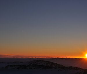 The sun sinking below the horizon at Casey — winter 2014