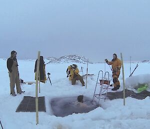 Steve Hankins swims in the icy water of the pool cut in the sea ice for Midwinter at Casey 2014