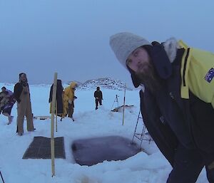 Cary Collis checks his Go Pro is going at the Casey Midwinter Swim 2014