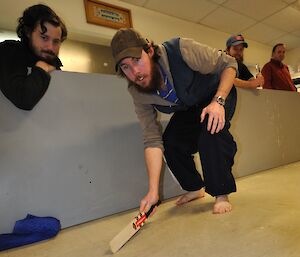 Steve McInnerney takes a shot at the ice puck during a game of ice hockey at Casey — Winter 2014