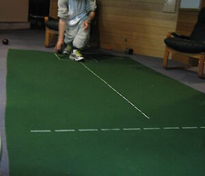 Steve McInnerney dressed in a koala onesy playing indoor bowls at Casey — winter 2014