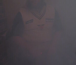 Stu Griggs works the smoke machine to obscure the golf hole during the Midwinter tournament at Casey — 2014