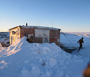 Expeditioners visit Wilkes Hilton (an old hut), near Casey station