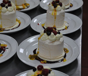 Individual pavlovas all plated up ready to serve at Casey 2014