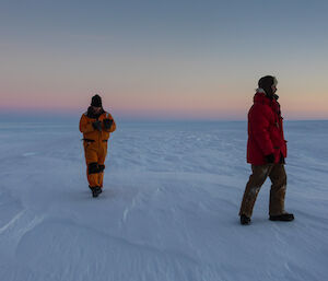 Two expeditioners enjoying the silence and isolation of the Wilkins aerodrome surrounds, near Casey station, Antarctica