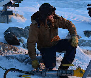 Nick Johnston working the valves during the winter refuelling at Casey