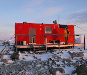 Robbos hut and an expeditioner, south of Casey station