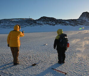 Expeditioners playing boules on the sea ice, en route to Peterson island