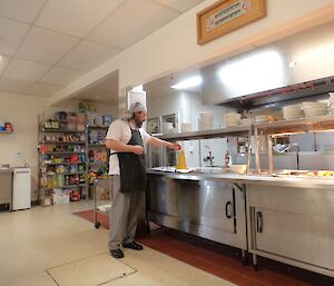 Eddie Dawson, the chef at Casey, adds vinegar to his dough volcano during National Science week August 2014