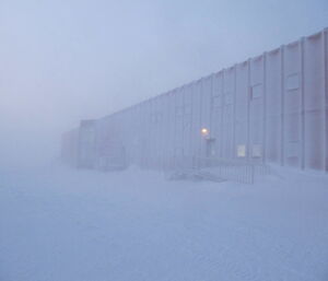 The red shed from the outside covered in snow during a blizzard at Casey winter 2014