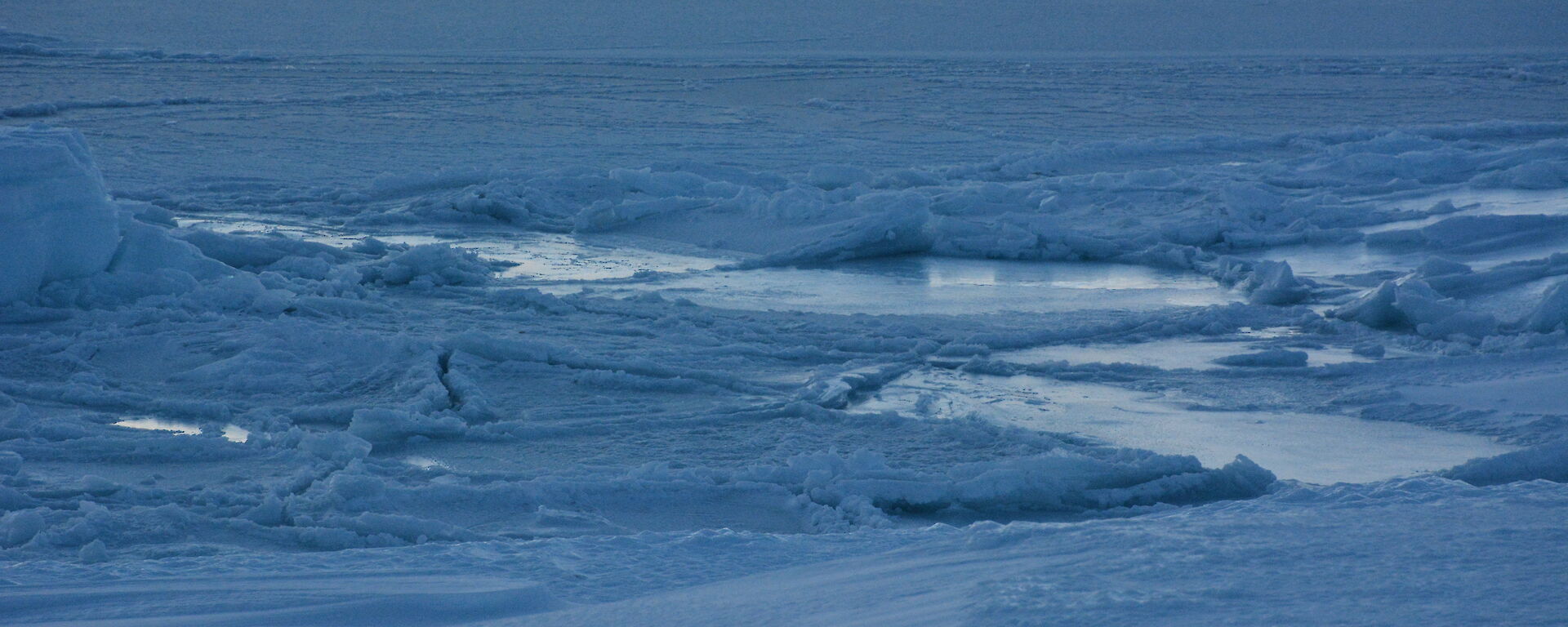 Sea ice turning to a slushy mix of ice and water, after a blizzard broke it up