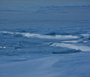 Sea ice turning to a slushy mix of ice and water, after a blizzard broke it up