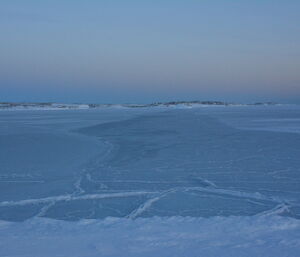 Sea ice of mixed thickness, looking flat and cold, between Wilkes and Casey station.
