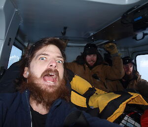 Excited expeditioners in the Hägglunds, on their way to the crash site