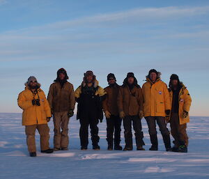 The expeditioners on the trip to the Neptune crash site, standing in a nice line.