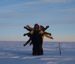 A group of expeditioners all lined up behind each other, making for a rather pointless photo.