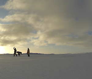 Steve Hankins, Dan Laban, and Cary Collis on the sea ice at casey ready to play a game of golf