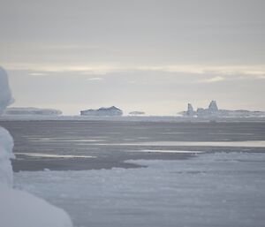 Greas ice forming on the sea with Batburg Is in the distance at Casey August 2014