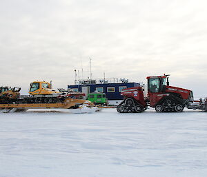 The groomer and skid steer arriving at Casey skiway to start preparing the surface for the first flights due in 2 weeks