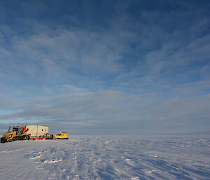 The vehicles in their parking spot for the first night, amongst the flat white nothingness of the Antarctic plateau