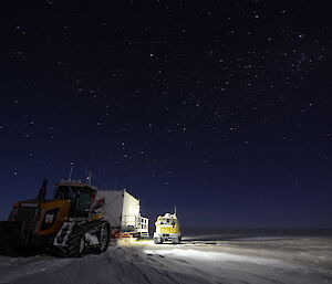 The Challenger and Hägglunds vehicles parked in the moonlight underneath a wide sky of stars