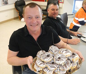 Pete Hargreaves and his stack of Bavarian cream rings at Casey