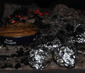 Foiled wrapped potatoes and a pie cooked in the cast iron fire box at Wilkes on the Clark Peninsula