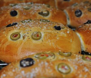 Foccacia with olives and rock salt just out of the oven on a tray at Casey