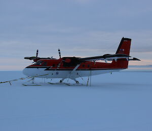 The Twin Otter tied down beside Casey Skiway