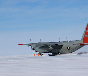A C-130 Hercules hurtles down the skiway at Casey, about to take off
