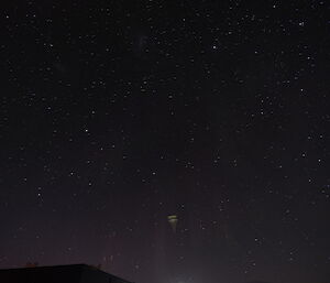 A lens flare type of aberration in a photo of an Aurora above Casey station