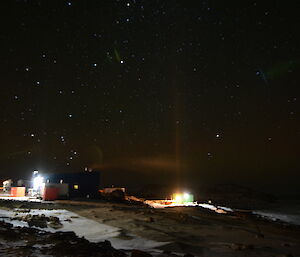 A lens flare type of aberration in a photo of an Aurora above Casey station