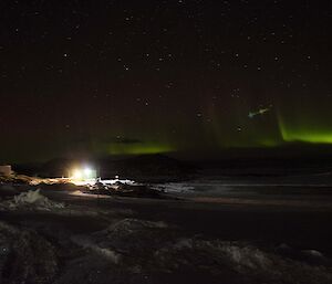 A lens flare type of aberration in a photo of an Aurora above Casey station