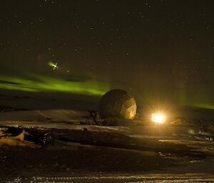 A lens flare type of aberration in a photo of an Aurora above Casey station