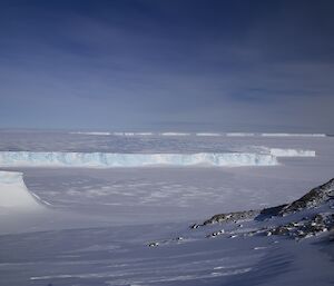 Scenic view of the blue ice tongue of the Vanderford glacier poking into the sea ice
