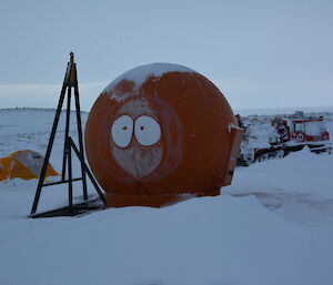 The Kenny’s hut emergency shelter well snowed in, on an overcast day