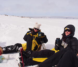 Expeditioners enjoying a cup of coffee at the survival camp