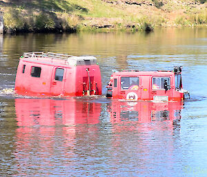 A Hägglunds floating in a dam