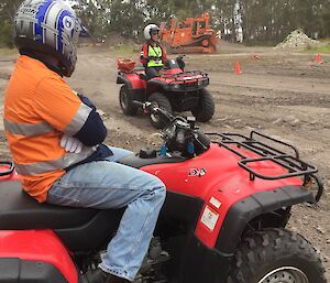An expeditioner sitting on a quad bike during training