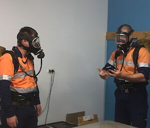 Two expeditioners practising with BA equipment