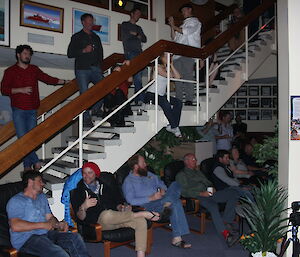 A group of expeditioners on the stairs looking at the band