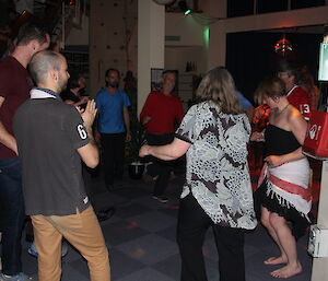 A group odf expeditioners dancing the night away