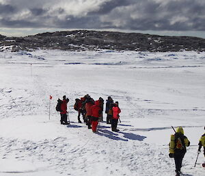 A group of expeditioners walking on the sea ice