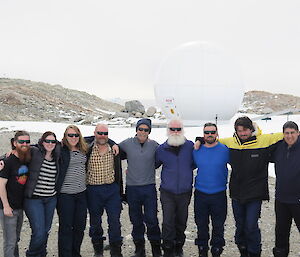 A group of expeditioners doing a staff handover.