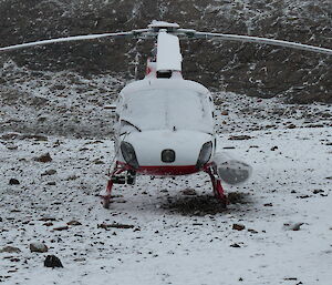 Helicopter waiting out a snow shower on Hop Island